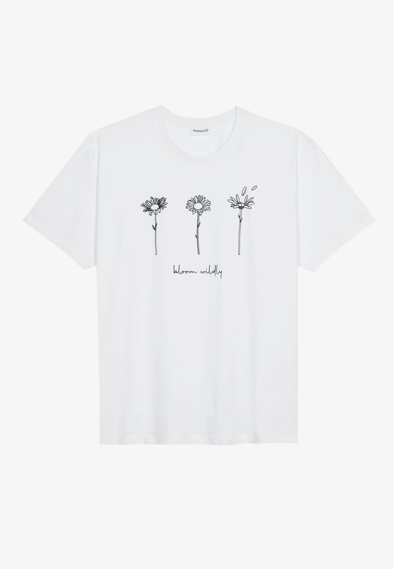 T-shirt blanc à manches courtes avec trois fleurs dessinées en lignes noires et la phrase "bloom wildly" sous les dessins.