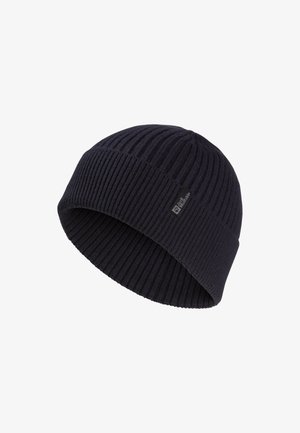 Dunkelblaues, geripptes Strickmützchen mit umgeschlagenem Bündchen und kleinem Jack Wolfskin Logo-Patch an der Seite.