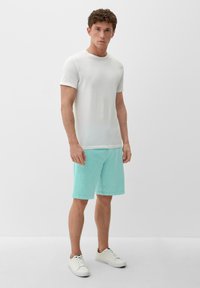 s.Oliver Pantaloni sportivi - helles türkis