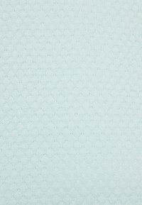 Light blue knitted sweater fabric with a subtle diamond pattern and small ventilation holes throughout.