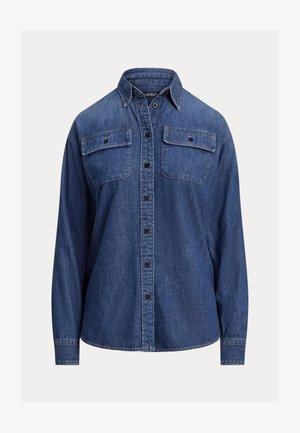 Denima krekls, dziļi zila krāsa, garas piedurknes, pogājams dizains, divas krūšu kabatas ar vāciņiem, redzamas šuves, brīva piegriezuma.