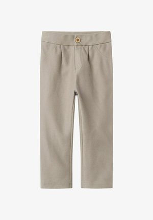 Beežist puuvillaseguse kangaga püksid, millel on puidust nööpiga vöökoht, ees pockets ja kitsenev jalgade disain. Tekstureeritud herringbone muster.