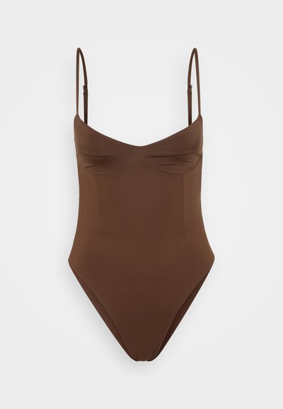 Brown one-piece swimsuit with thin, adjustable straps, a sweetheart neckline, and smooth fabric. Features no visible patterns or hardware.