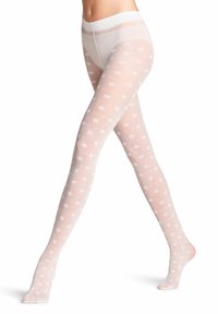 Collant bianchi a pois con finitura trasparente e liscia; vita morbida con bordi a scallop; design a metà polpaccio che evidenzia il materiale leggero.