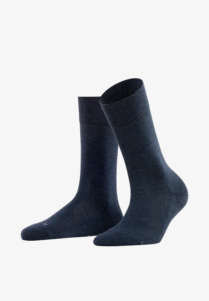 Σκούρο μπλε βαμβακερές κάλτσες με λείο υλικό, μήκους μέχρι τη μέση της γάμπας, και ενισχυμένες περιοχές στη φτέρνα και τα δάχτυλα. Απλός, μονόχρωμος σχεδιασμός.