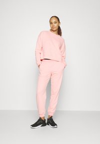 Puma LOUNGEWEAR SUIT - Tuta - peach smoothie