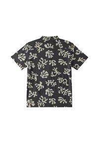 Chemise noire à manches courtes avec des motifs abstraits blancs en forme de feuille, vue de dos.