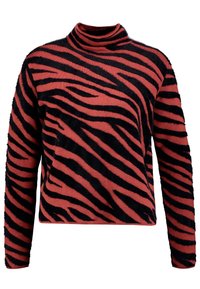 Maglione a collo alto a righe rosse e nere con una texture morbida e pelosa e maniche lunghe, caratterizzato da un distintivo motivo a strisce zebrate.