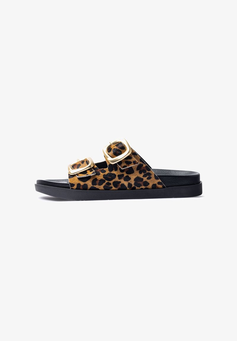 Leopard print slide sandal with dual gold buckle straps. Soft textured upper, black rubber sole, open toe design, minimalistic shape.