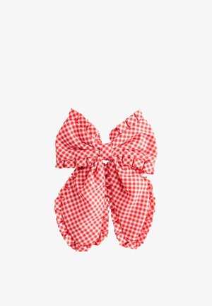 Red and white gingham check fabric bow with ruffled edges on a white background.