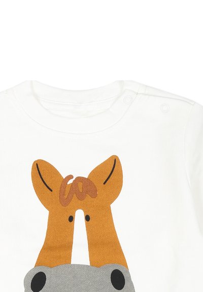 Camicia bianca a maniche lunghe con grafica di animali colorati che presenta orecchie marroni e un corpo grigio. Chiusura a scatto sul collo per facilitare l'inserimento.