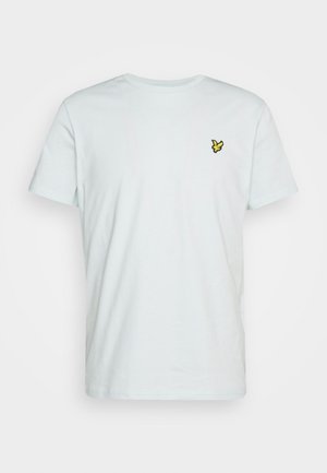 Jasnoniebieska bawełniana koszulka z okrągłym dekoltem i krótkimi rękawami. Na lewej piersi znajduje się małe żółte logo z haftowanym ptakiem.