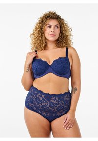 Navy blue lace bra and high-waisted brief set with scalloped edges and floral pattern. Adjustable straps and soft lining for comfort.