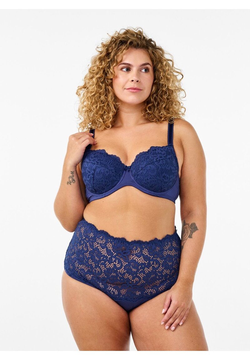 Navy blue lace bra and high-waisted brief set with scalloped edges and floral pattern. Adjustable straps and soft lining for comfort.