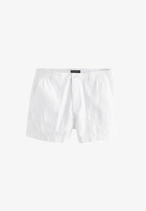 Valkoiset puuvillashortsit, joissa on joustava vyötärö, etupainikekiinnitys ja kaksi sivutaskua. Liukas pinta, polvipituinen leikkaus.