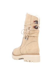 Botte en daim beige avec une surface texturée, un col rembourré et des lacets avec accents rouges. Elle présente une semelle en caoutchouc robuste avec des rainures.