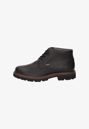 Stivaletto in pelle nera con chiusura con lacci, suola cucita marrone e battistrada robusto, mostrato in profilo laterale su sfondo bianco.