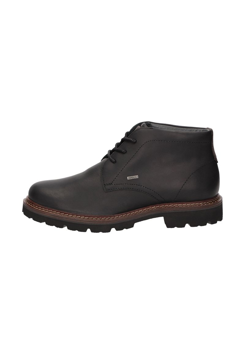 Bottine en cuir noir avec fermeture à lacets, semelle brown cousue, et semelle à crampons, montrée en profil latéral sur fond blanc.