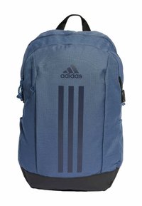 Blue fabric backpack with black bottom, featuring a zippered closure and Adidas logo with three vertical stripes. Durable, textured material.