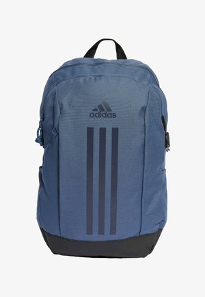 Sininen kangaskassi, jossa on musta pohja, varustettuna vetoketjullisella sulkemisella ja Adidas-logolla, jossa on kolme pystysuoraa raitaa. Kestävä, teksturoitu materiaali.
