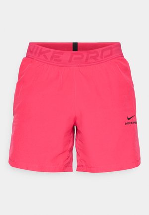 Pink athletic shorts made of soft fabric, featuring a black "Nike Pro" logo on the front and a textured waist band for comfort.