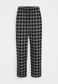 Črne in bele karirane hlače za sproščeno nošenje z vrvico v pasu, ravne noge in mehak material. Primerne za vsakodnevno nošenje.