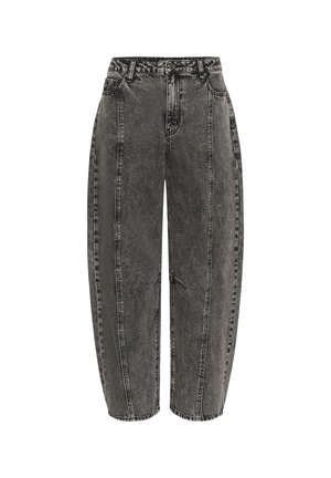 Jean en denim noir avec une coupe ample, présentant une taille haute, une texture déchirée et des coutures visibles le long des coutures latérales.