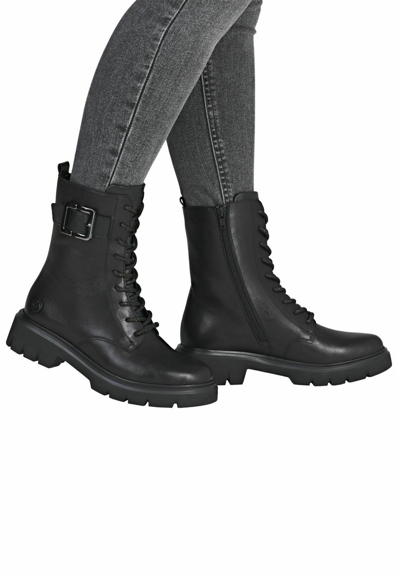 Bottines en cuir noir avec lacets, fermeture éclair latérale et accent en boucle en métal. Semelle en caoutchouc épaisse et texture lisse. Convient à diverses occasions.