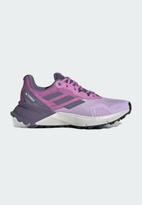 Lilla og grå Adidas Terrex trail løbesko med tekstureret sål, polstret mellemsål og snøredesign.