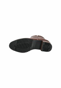 Brown leather boot with a rounded toe, a sturdy black rubber sole featuring deep treads, and a subtle seam detail along the upper.
