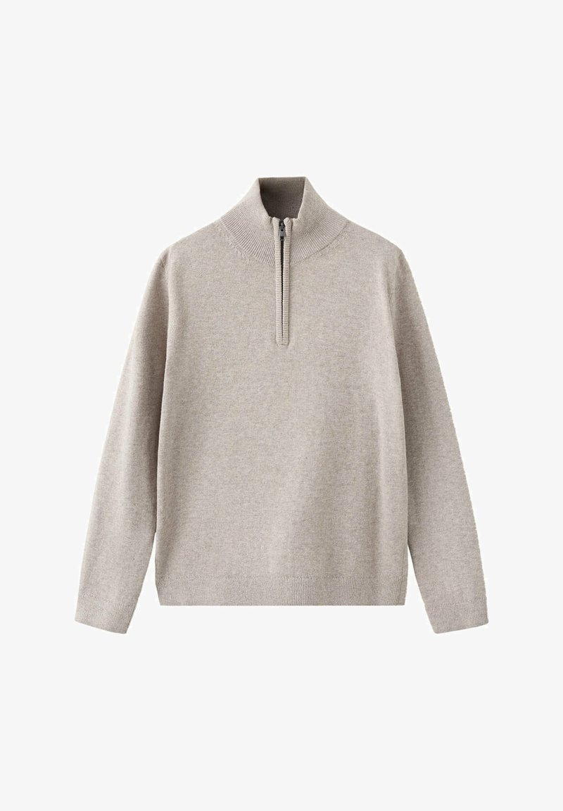 Pull beige clair à manches longues avec un col montant côtelé et une courte fermeture éclair à l'avant.