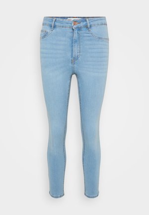 Lichtblauwe skinny jeans van denim. Heeft vijf zakken, een sluiting met een knoop aan de voorkant en subtiele vervaging langs de benen.