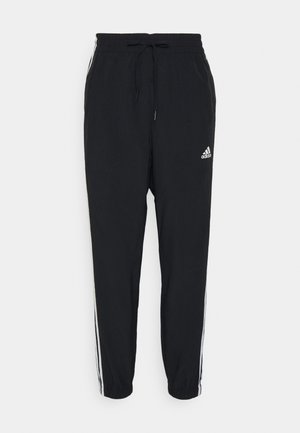 BLUV - Tracksuit bottoms - black/white