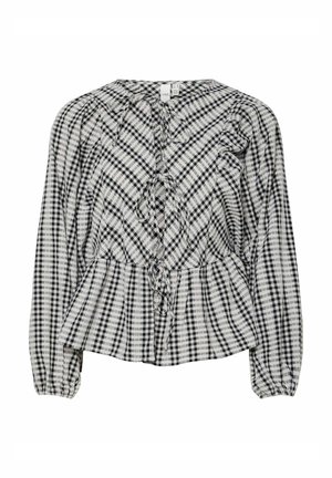 Zwart-wit geruite blouse met pofmouwen, een peplum taille en een voorste striksluiting. Zachte stof met zichtbare tekstpatronen doorheen.