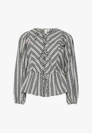 Zwart-wit geruite blouse met pofmouwen, een peplum taille en een voorste striksluiting. Zachte stof met zichtbare tekstpatronen doorheen.