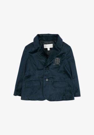 Blazer in velluto blu navy con colletto a lancia, due tasche frontali e chiusura con un bottone singolo. Include dettaglio con stemma ricamato.