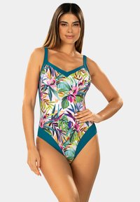 Jednoczęściowy strój kąpielowy z żywym tropikalnym wzorem kwiatowym w odcieniach różu, zieleni i żółci, z turkusowymi akcentami na dekolcie i biodrach.