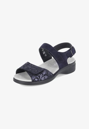Sandale femme bleu marine à bout ouvert, avec des brides ajustables et une semelle basse rembourrée pour le confort et le soutien.