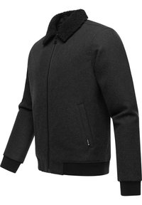 Black fleece jacket with a textured collar, zip closure, and two side pockets. Ribbed cuffs and hem provide a fitted look.