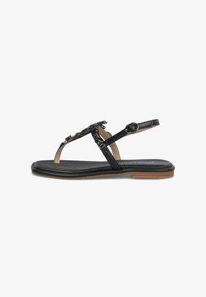 Sandalia plana negra con tiras finas, hebilla en el tobillo y adornos de cuentas en la tira del dedo, con borde de suela en color tostado.