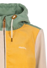 Cord-Hoodie mit grünem Kapuzenfutter, gelbem Vorderteil, beigen Ärmeln, durchgehendem Reißverschluss, Kordelzug und kleinem, auf der Brust gesticktem Markenlogo.