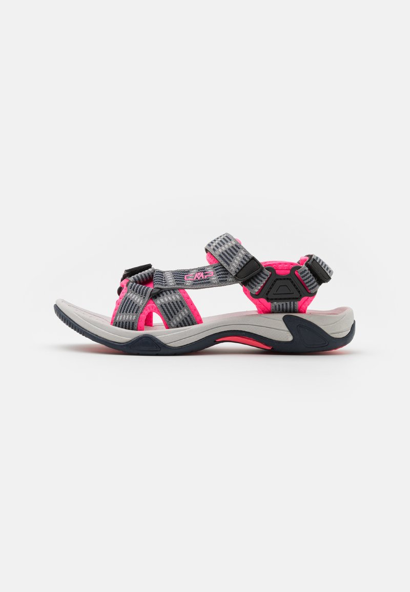 Sport sandal with a gray outsole, pink accents, and adjustable straps featuring a striped pattern in black and gray. Breathable design.