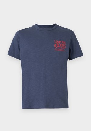 Navy blue short-sleeve t-shirt in soft fabric, featuring a red graphic print on the left chest with text and detailing. Round neck design.