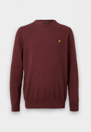 Bordó hosszú ujjú környakas pulóver, bal mellrészen kis sárga madár hímzéssel.