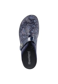 Navy mule shoe with a textured upper, featuring a glossy strap and a floral metal accent. Interior has dark padding.