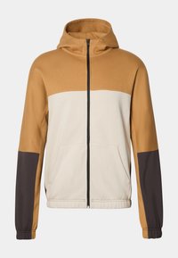 Sudadera con capucha que presenta un diseño a bloques de color en beis claro, marrón y marrón oscuro. Con cremallera frontal, dos bolsillos laterales y puños elásticos.