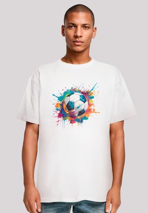 White cotton t-shirt featuring a colorful splash design around a black and white soccer ball. Short sleeves and relaxed fit.