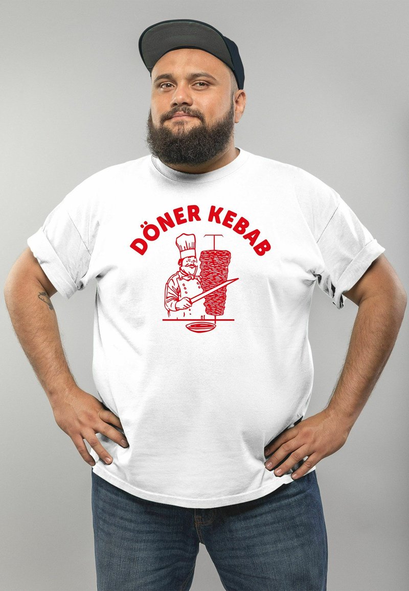 White t-shirt with a red graphic illustrating a chef and a döner kebab, featuring the text "DÖNER KEBAB" in bold red letters.