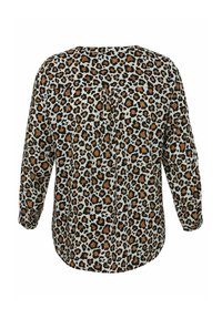 Blouse met luipaardprint op een lichte achtergrond, lange mouwen, een ronde zoom en een strikdetail op de rug. Gemaakt van zachte, lichte stof.