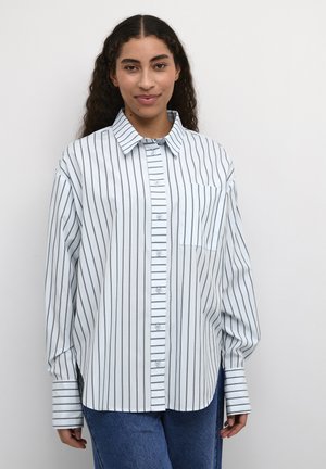 Striped button-up shirt in light blue with dark vertical lines, featuring a collar, long sleeves, and a single chest pocket.